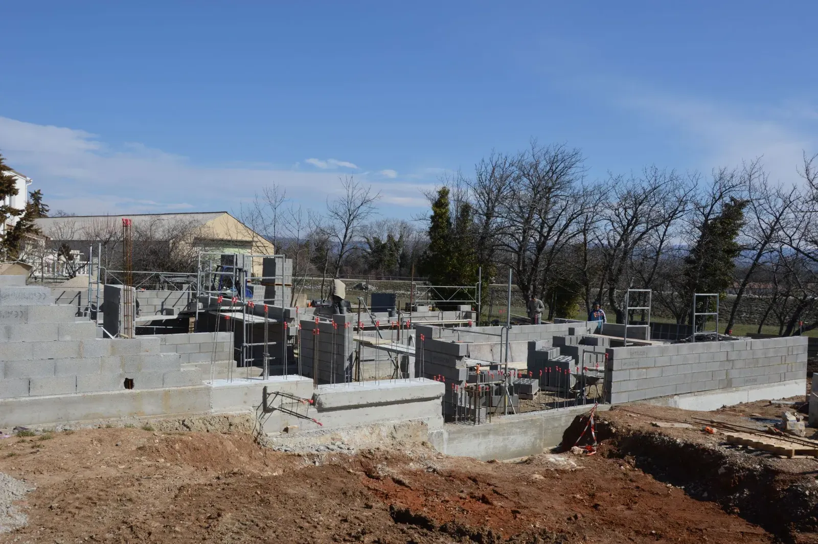 New residential foundation under construction with poured concrete footings and block walls in the Tulsa, Oklahoma metro